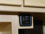 A close-up of a black thermostat , showing a screen reading 68. 3